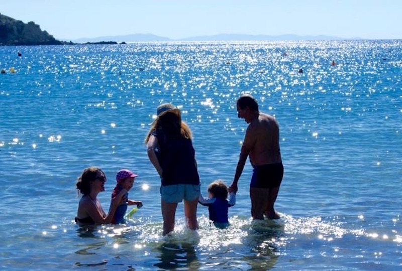 4 Reasons Why Greece is the Best Holiday for Kids. Greek people swimming with children.